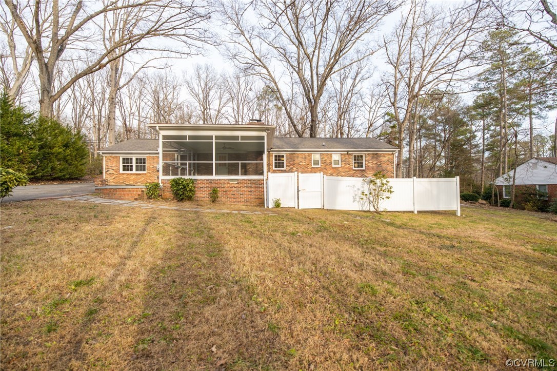 1818 Bloomfield Road Richmond, VA 23225 - Photo 35 of 45 a front view of a house with a garden and trees