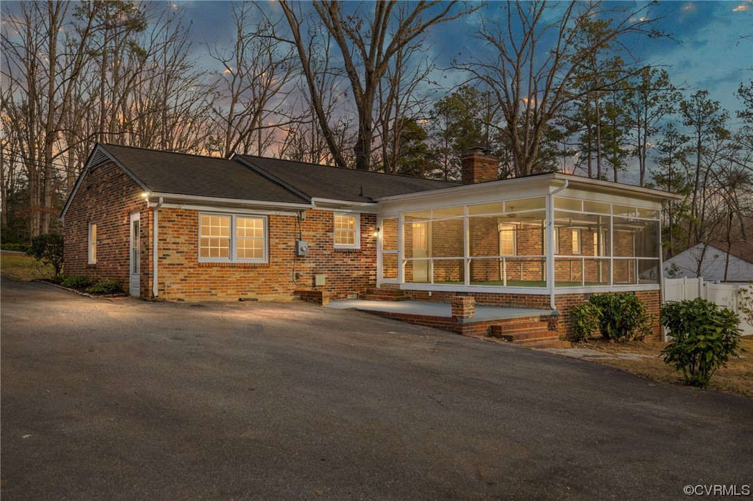 1818 Bloomfield Road Richmond, VA 23225 - Photo 45 of 45 a view of a house with a large tree and wooden fence