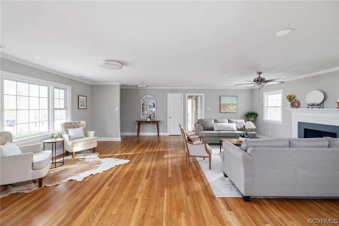 1818 Bloomfield Road Richmond, VA 23225 - Photo 8 of 45 a living room with furniture and a wooden floor