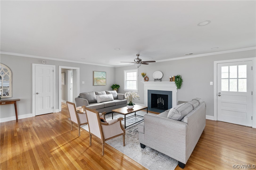 1818 Bloomfield Road Richmond, VA 23225 - Photo 9 of 45 a living room with furniture and a fireplace