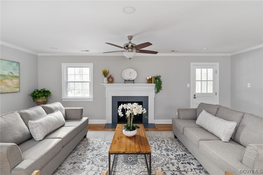 1818 Bloomfield Road Richmond, VA 23225 - Photo 10 of 45 a living room with furniture a fireplace and window