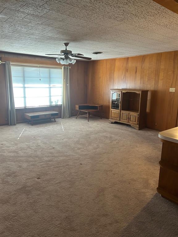 910 South Varella Street Mexia, TX 76667 - Photo 7 of 14 a view of a livingroom with a fireplace and window