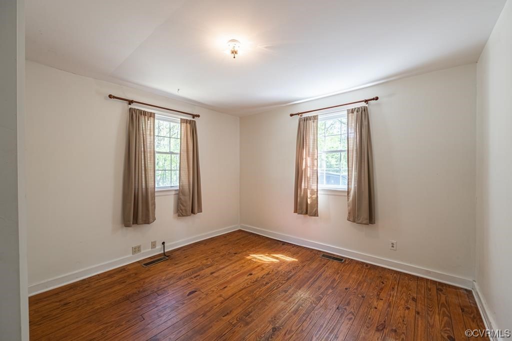 2153 Featherfin Road Prospect, VA 23960 - Photo 4 of 12 an empty room with wooden floor and windows