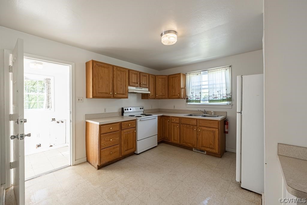 2153 Featherfin Road Prospect, VA 23960 - Photo 6 of 12 a kitchen with granite countertop a stove top oven sink and cabinets