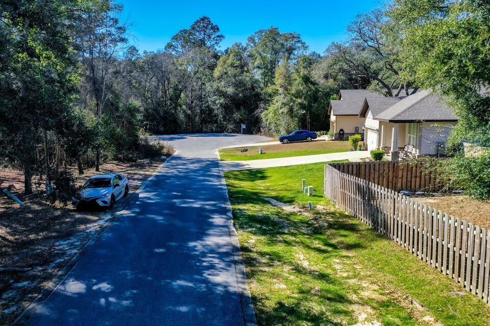 Lot 64 Jake South Way Freeport, FL 32439 - Photo 1 of 8 a view of a garden with wooden fence