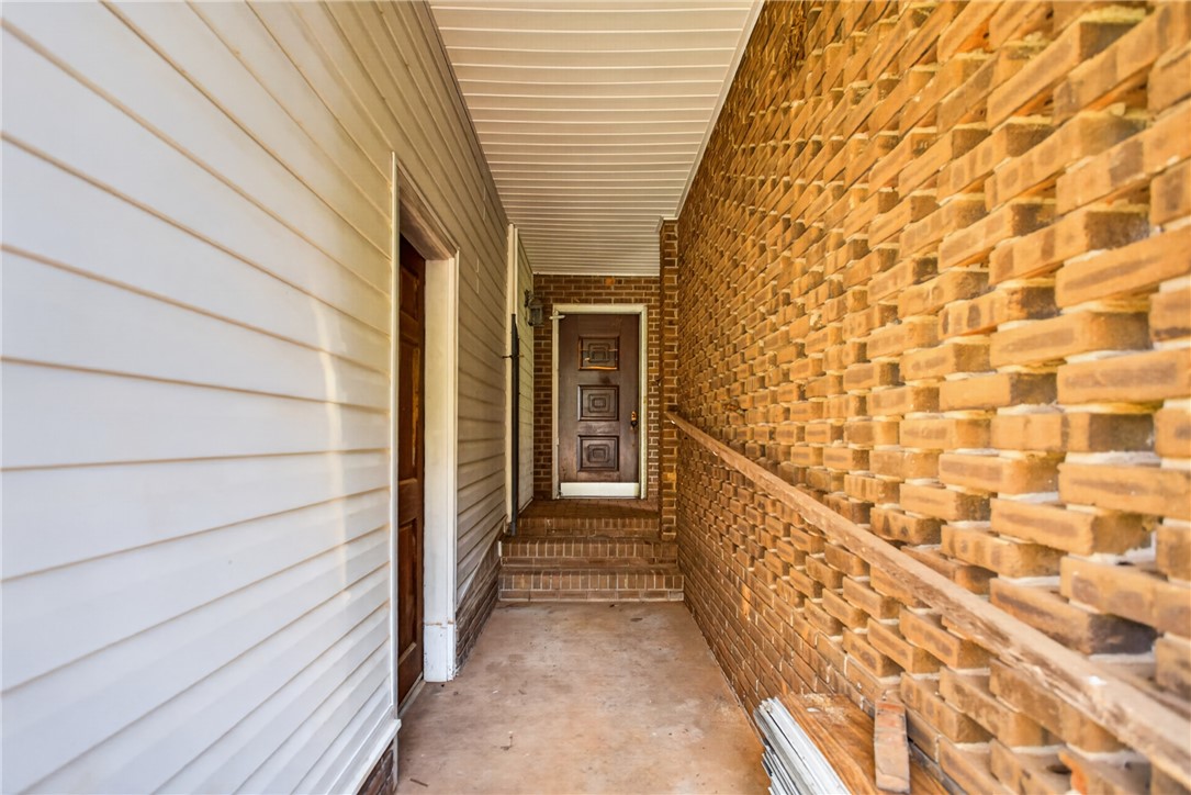 1412 Simpson Road Pendleton, SC 29670 - Photo 34 of 48 A welcoming brick entryway with a wooden front door beckons.