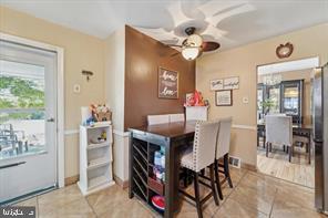 503 Bonsall Avenue Lansdowne, PA 19050 - Photo 13 of 24 a view of a dining room with furniture and a chandelier fan