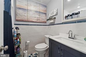 503 Bonsall Avenue Lansdowne, PA 19050 - Photo 14 of 24 a bathroom with a sink a toilet and a mirror