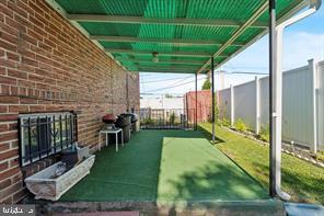 503 Bonsall Avenue Lansdowne, PA 19050 - Photo 22 of 24 a view of a porch with couches and table under an umbrella