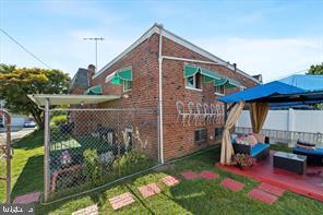 503 Bonsall Avenue Lansdowne, PA 19050 - Photo 23 of 24 a view of a chair and table in backyard