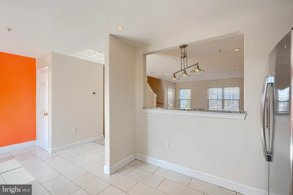 a view of a big room with closet and windows