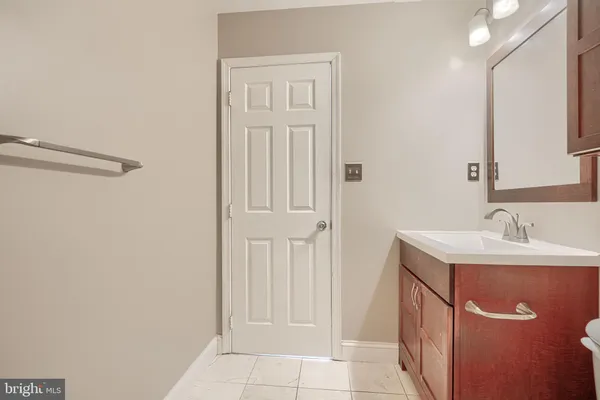 a bathroom with bathtub and shower