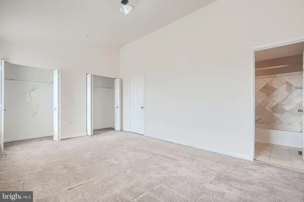 a bedroom with a bed and closet