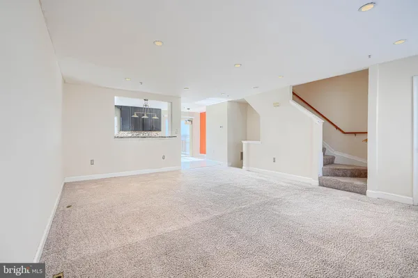 a view of an entryway with an empty room