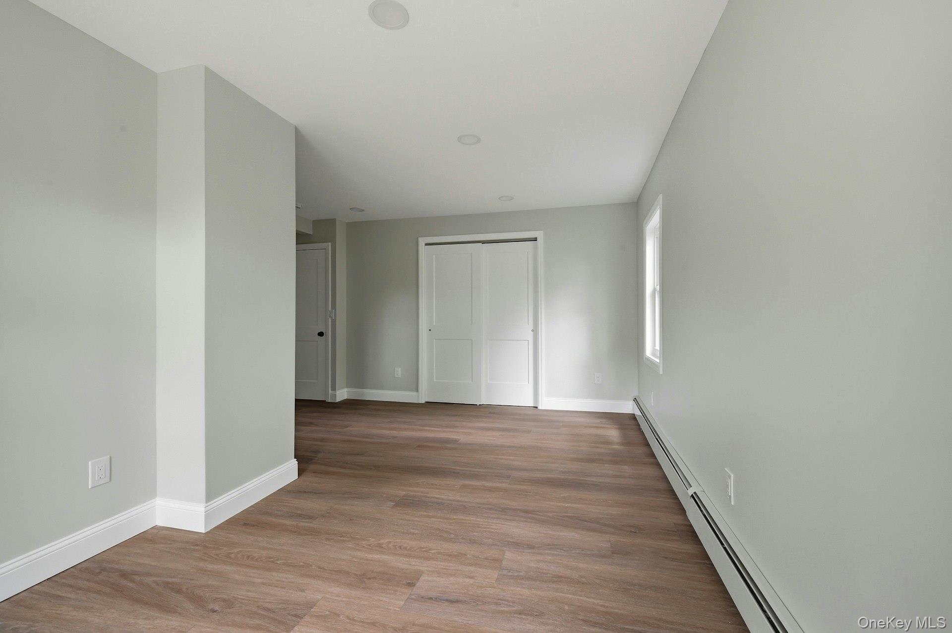 101 Rustic Road Centereach, NY 11720 - Photo 32 of 42 a view of a livingroom with wooden floor