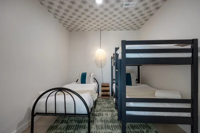 a bathroom with a granite countertop bathtub shower and toilet