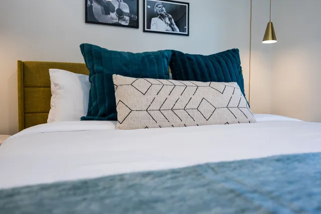 a front view of building with outdoor seating and yard