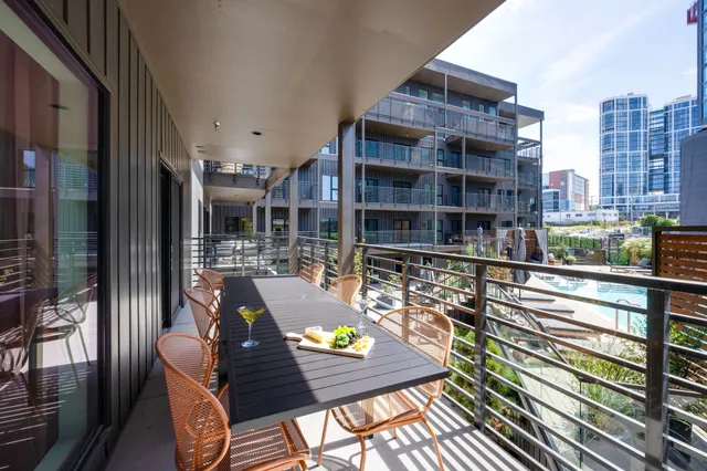 a view of a patio with couches and potted plants