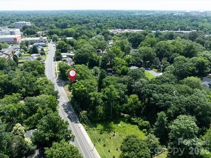 an aerial view of residential house with outdoor space and street view