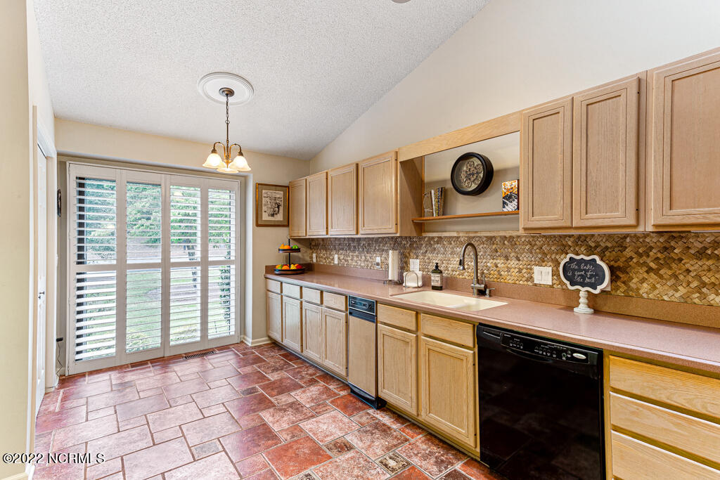 4 Lake Pinehurst Villas Road Pinehurst, NC 28374 - Photo 12 of 56 Tile flooring with vaulted ceiling & skylight in the kitchen