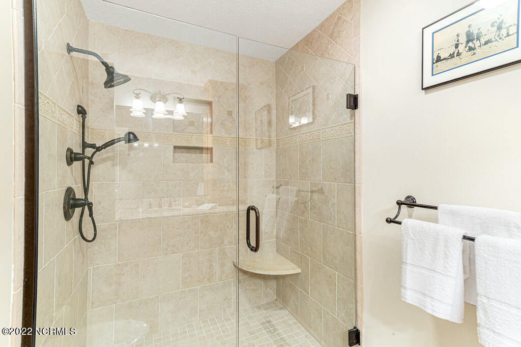4 Lake Pinehurst Villas Road Pinehurst, NC 28374 - Photo 17 of 56 Primary bath with walk in shower beautifully tiled