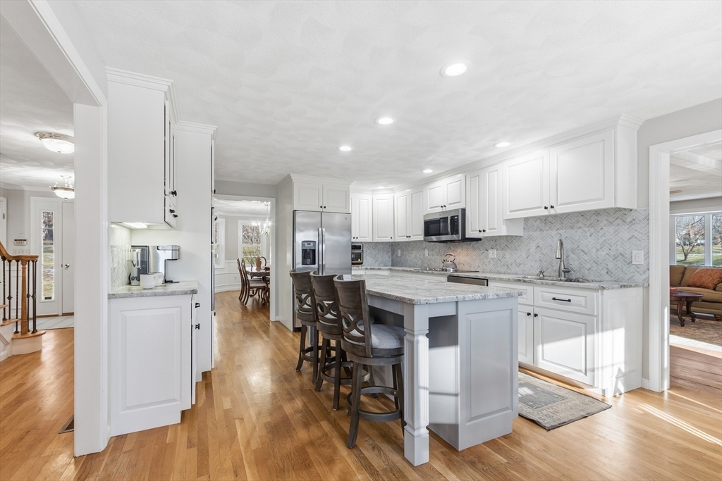 33 Overlook Drive Groton, MA 01450 - Photo 11 of 41 a open kitchen with white cabinets and stainless steel appliances