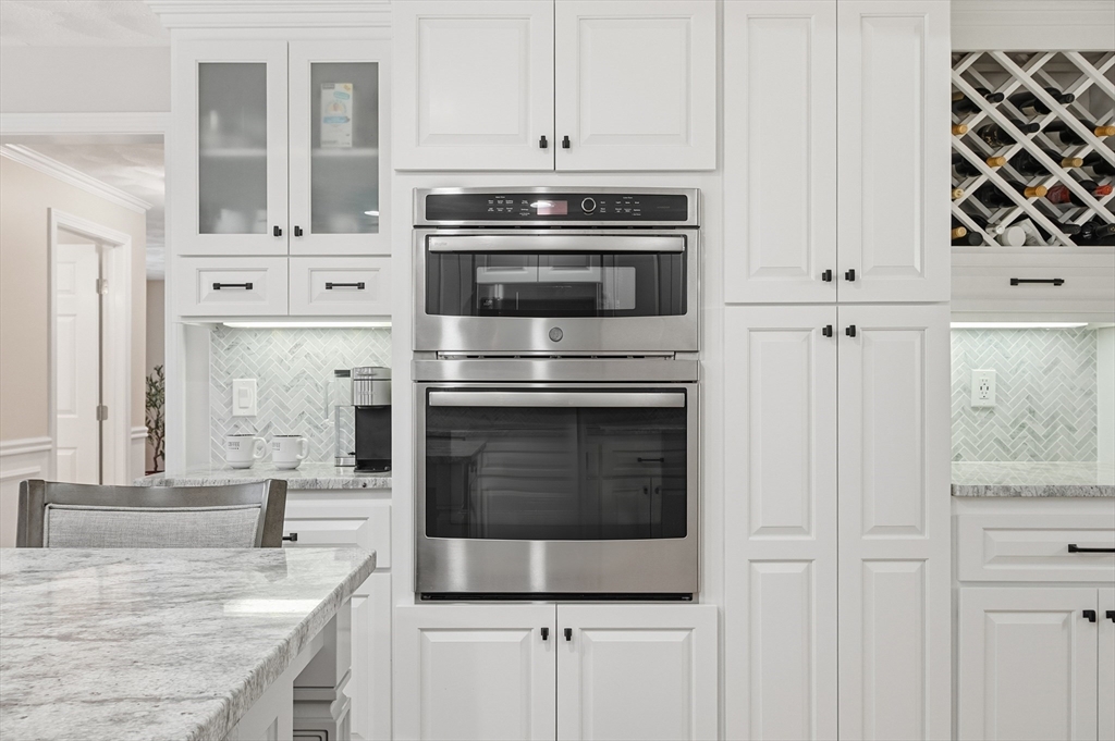 33 Overlook Drive Groton, MA 01450 - Photo 14 of 41 a kitchen with granite countertop a stove and a microwave