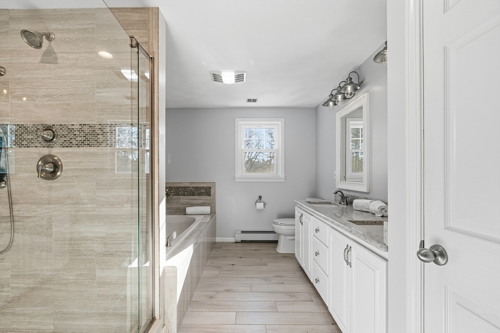 33 Overlook Drive Groton, MA 01450 - Photo 23 of 41 a bathroom with a granite countertop sink a mirror and a shower