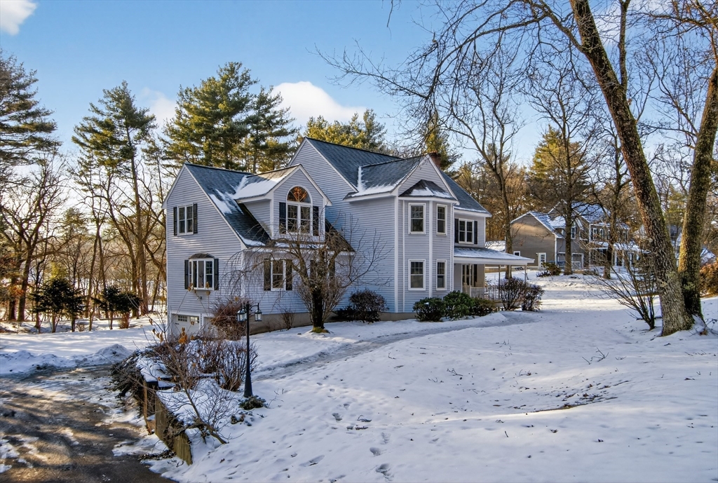 33 Overlook Drive Groton, MA 01450 - Photo 3 of 41 a front view of a house with a yard covered with snow
