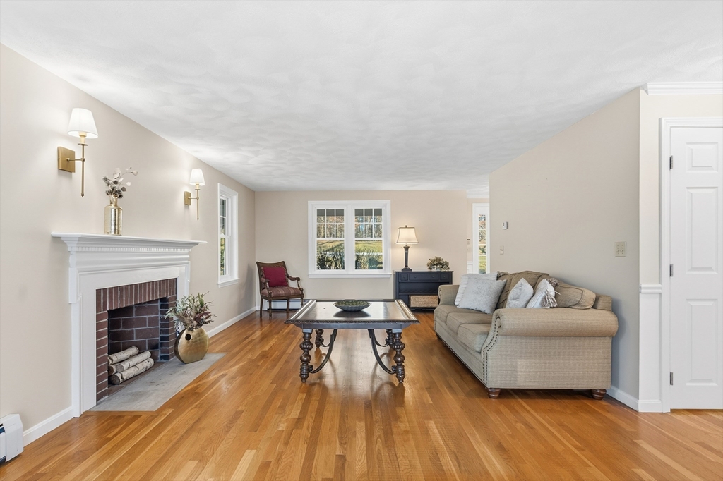 33 Overlook Drive Groton, MA 01450 - Photo 9 of 41 a living room with furniture and a fireplace