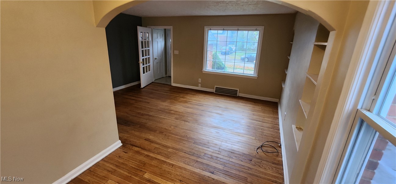 4161 Lambert Road Cleveland, OH 44121 - Photo 5 of 18 Spare room with wood-type flooring