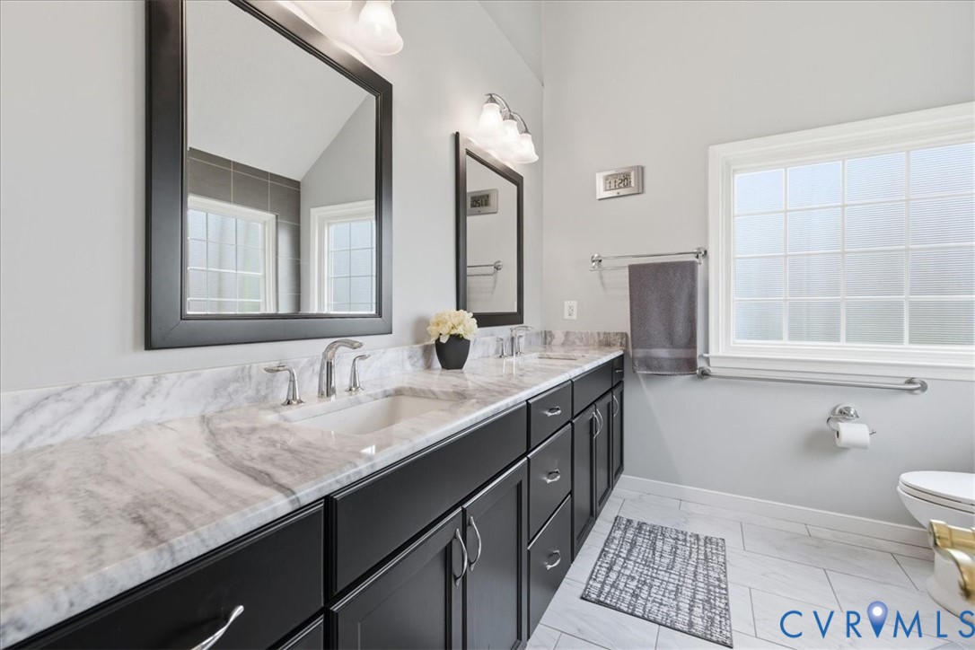 4601 Fall Harvest Court Prince George, VA 23875 - Photo 21 of 49 a bathroom with a granite countertop sink and a mirror
