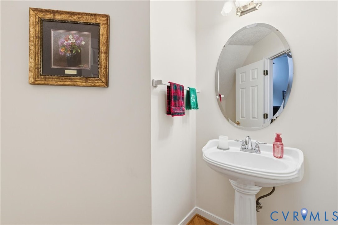 4601 Fall Harvest Court Prince George, VA 23875 - Photo 24 of 49 a bathroom with a sink and a mirror