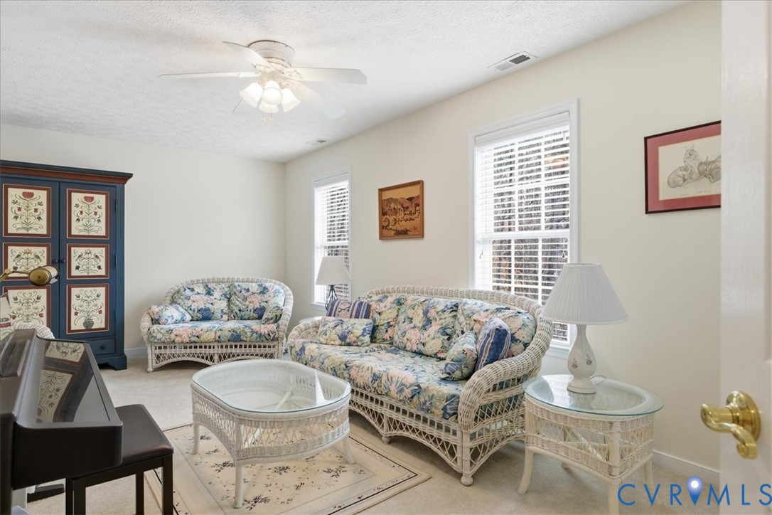 4601 Fall Harvest Court Prince George, VA 23875 - Photo 26 of 49 a living room with furniture and a large window