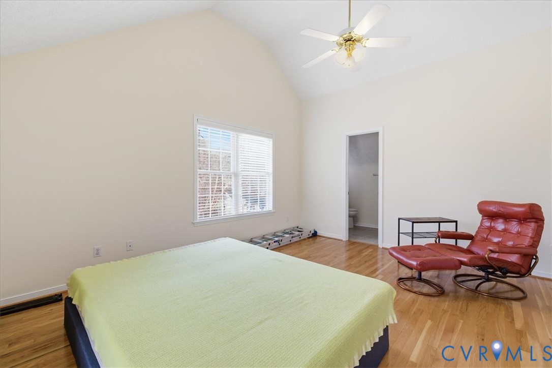 4601 Fall Harvest Court Prince George, VA 23875 - Photo 36 of 49 a bedroom with a bed dresser and a dining table