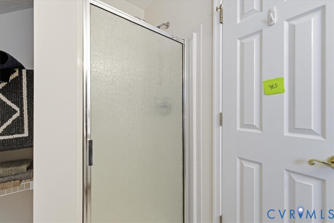 4601 Fall Harvest Court Prince George, VA 23875 - Photo 39 of 49 a bathroom with a shower and a sink