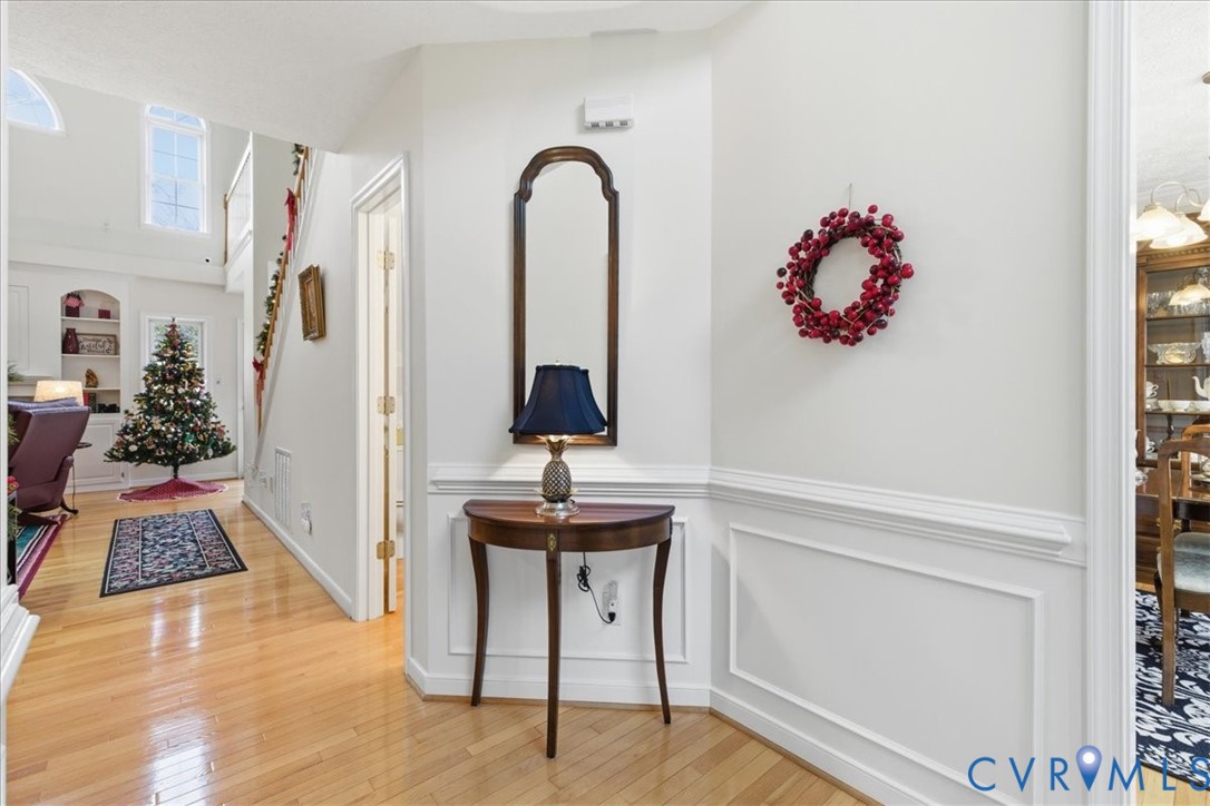 4601 Fall Harvest Court Prince George, VA 23875 - Photo 6 of 49 a view of a hallway with entryway wooden floor and front door