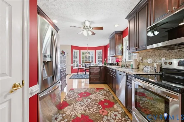a bedroom with a bed window and a flat screen tv