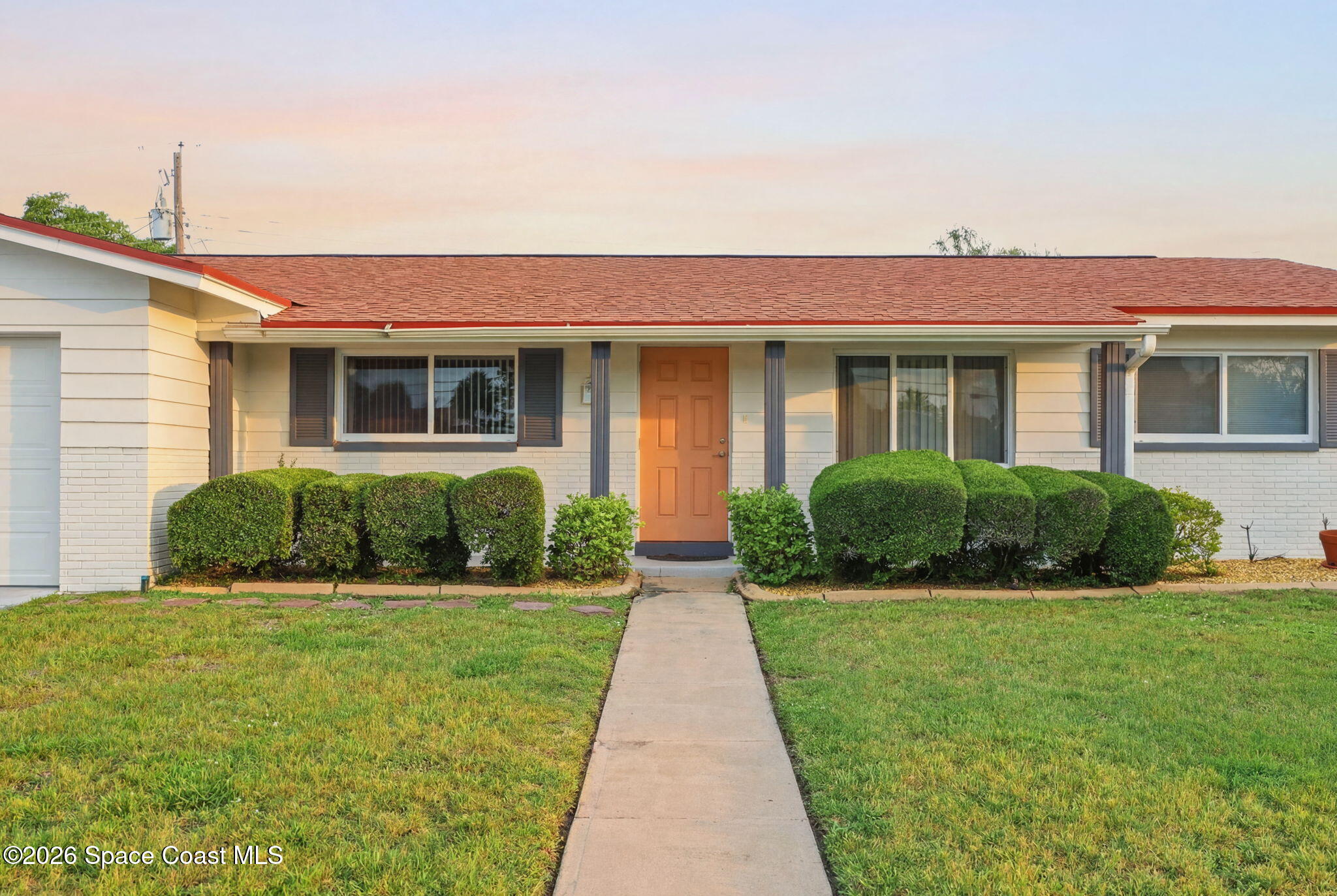 908 Jefferson Road Rockledge, FL 32955 - Photo 27 of 37 a view of a house with a yard