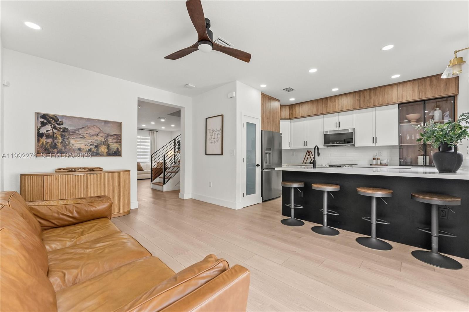 10487 West 34th Court Hialeah, FL 33018 - Photo 11 of 57 a living room with stainless steel appliances kitchen island granite countertop furniture and a view of kitchen