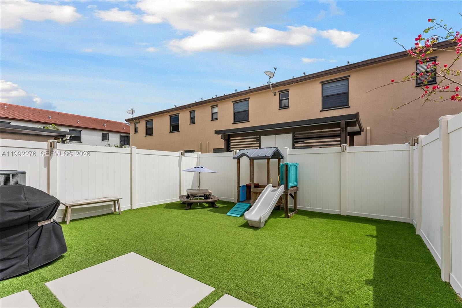 10487 West 34th Court Hialeah, FL 33018 - Photo 18 of 57 a view of a backyard with furniture
