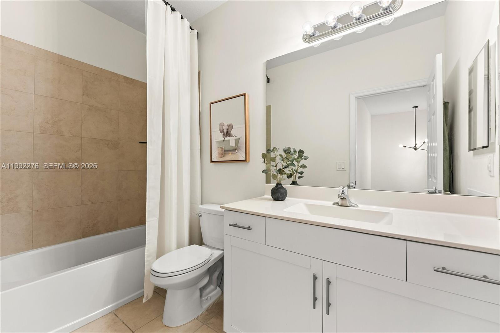 10487 West 34th Court Hialeah, FL 33018 - Photo 31 of 57 a bathroom with a sink a toilet and shower