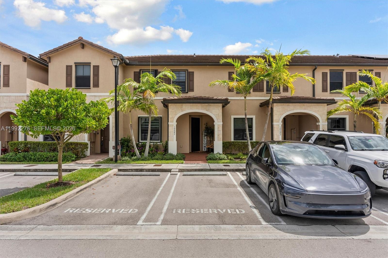 10487 West 34th Court Hialeah, FL 33018 - Photo 34 of 57 a front view of a house with a garden