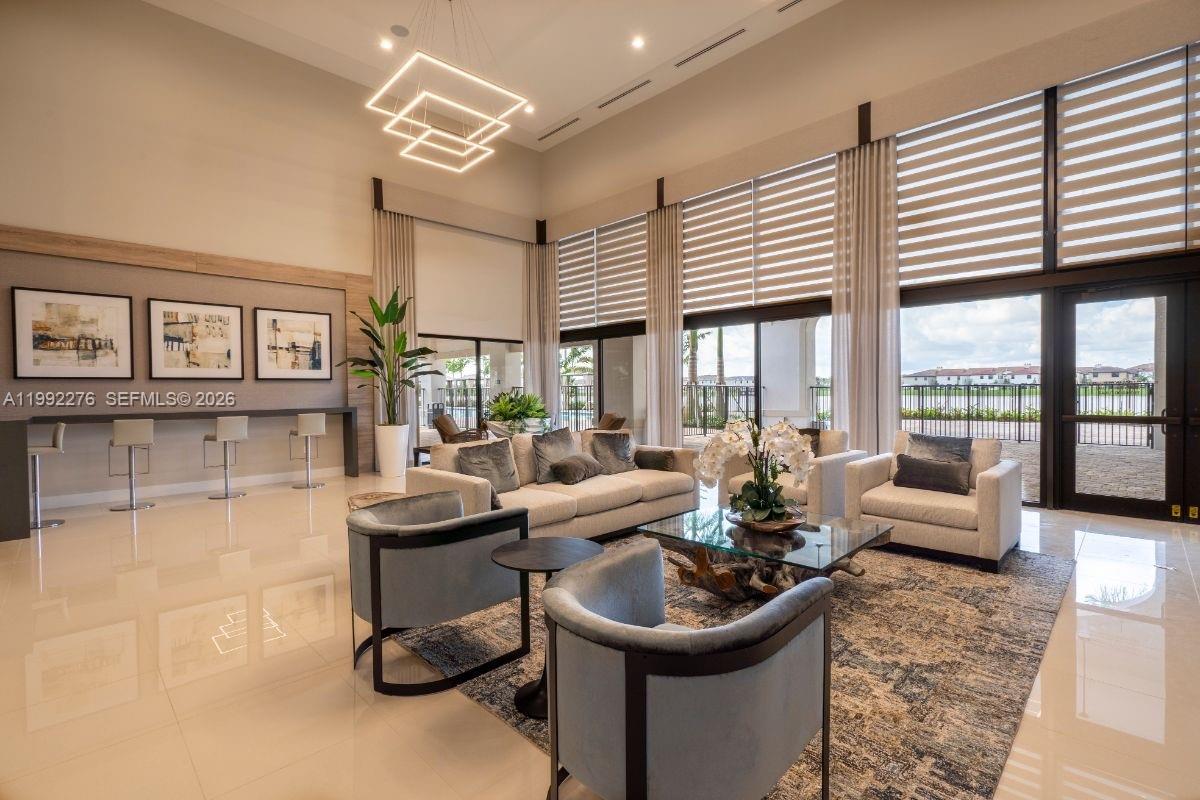 10487 West 34th Court Hialeah, FL 33018 - Photo 47 of 57 a living room with furniture and large windows