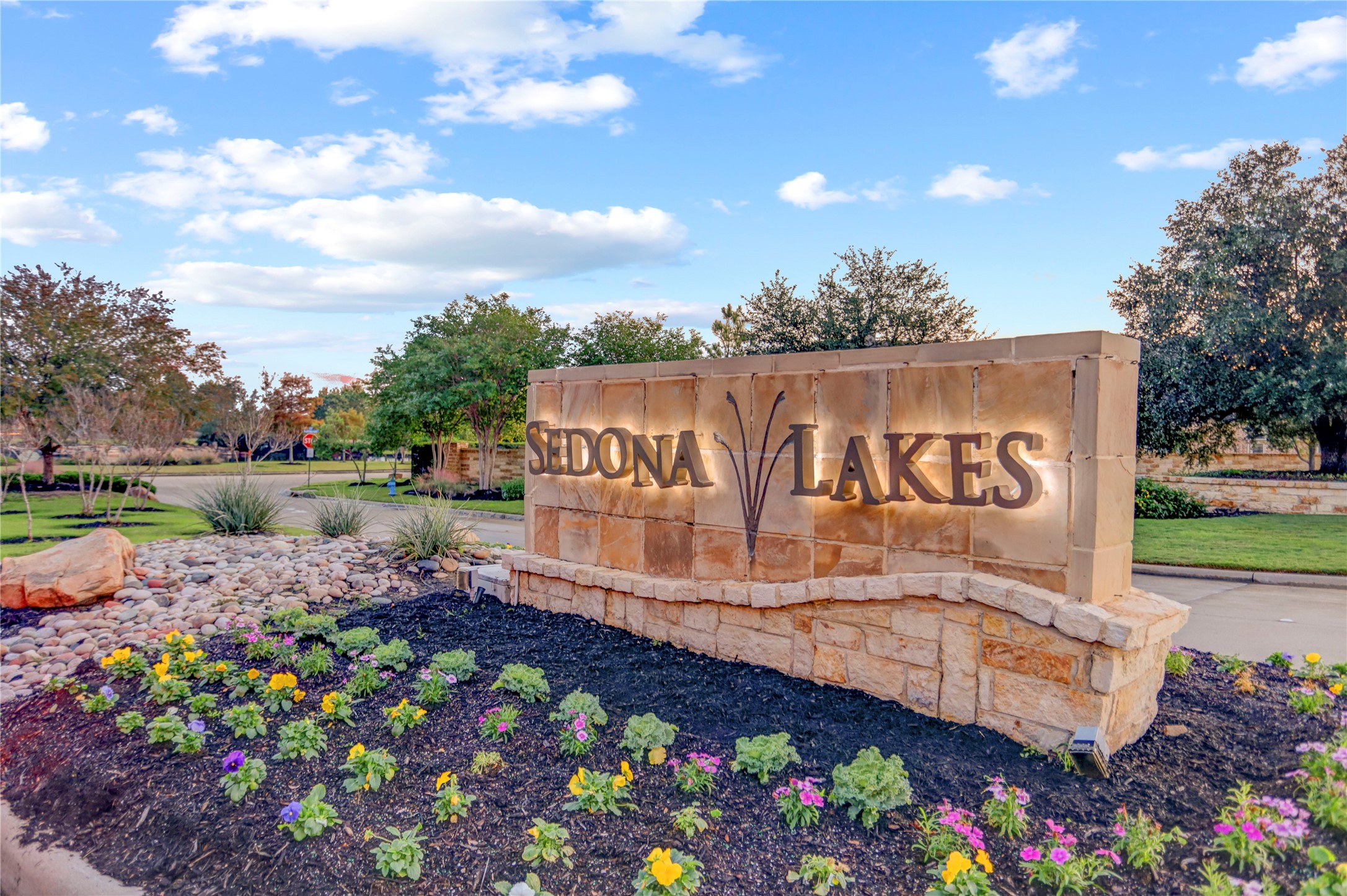 3002 Currant Drive Manvel, TX 77578 - Photo 40 of 43 a sign that is in front of flowers