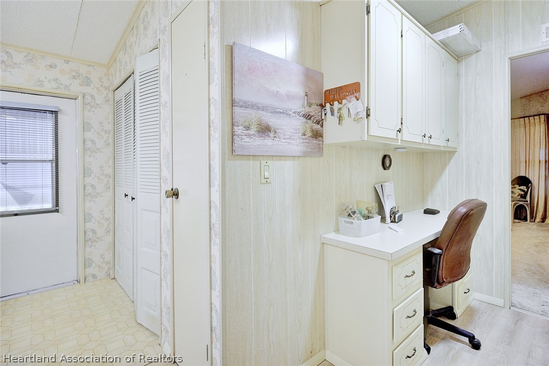 1571 Caribbean Road Sebring, FL 33870 - Photo 16 of 41 a view of cabinets a sink and dishwasher in a white cabinet