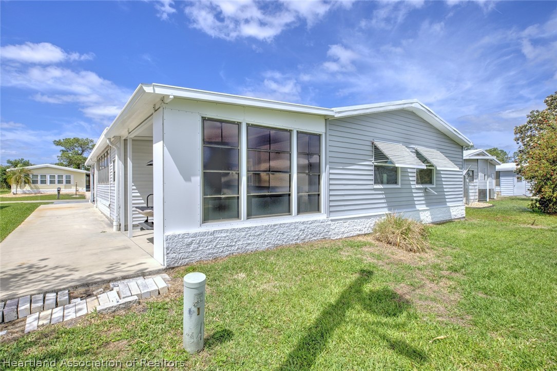 1571 Caribbean Road Sebring, FL 33870 - Photo 35 of 41 a view of a house with backyard