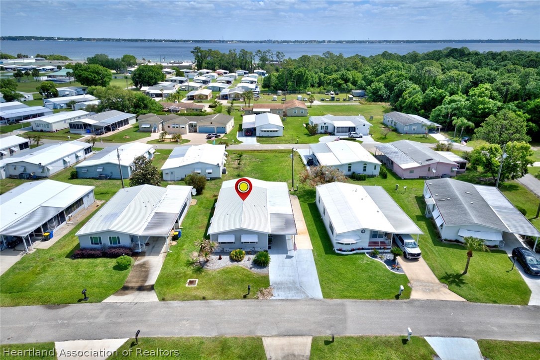1571 Caribbean Road Sebring, FL 33870 - Photo 36 of 41 an aerial view of a house with a garden