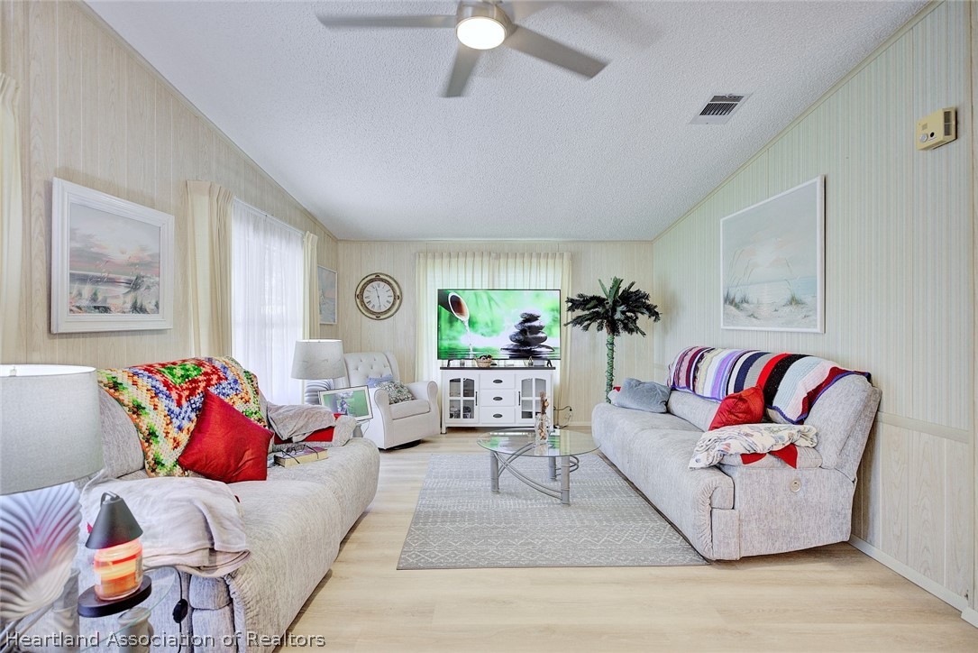 1571 Caribbean Road Sebring, FL 33870 - Photo 7 of 41 a living room with furniture