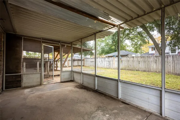 a view of an empty room with a balcony